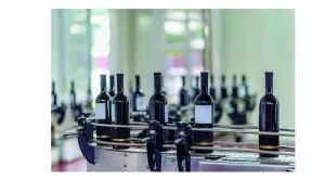 Wine bottles in a labelling machine
